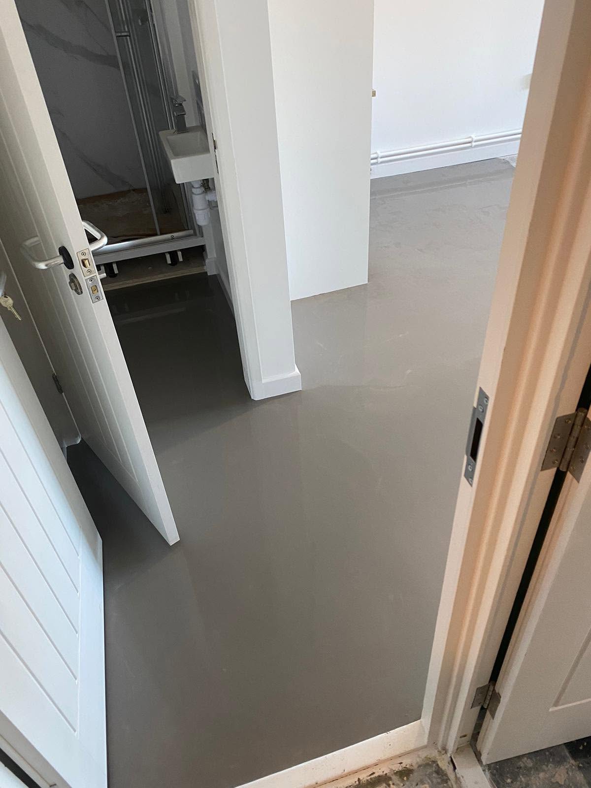 Smooth screeded floor seen through a doorway