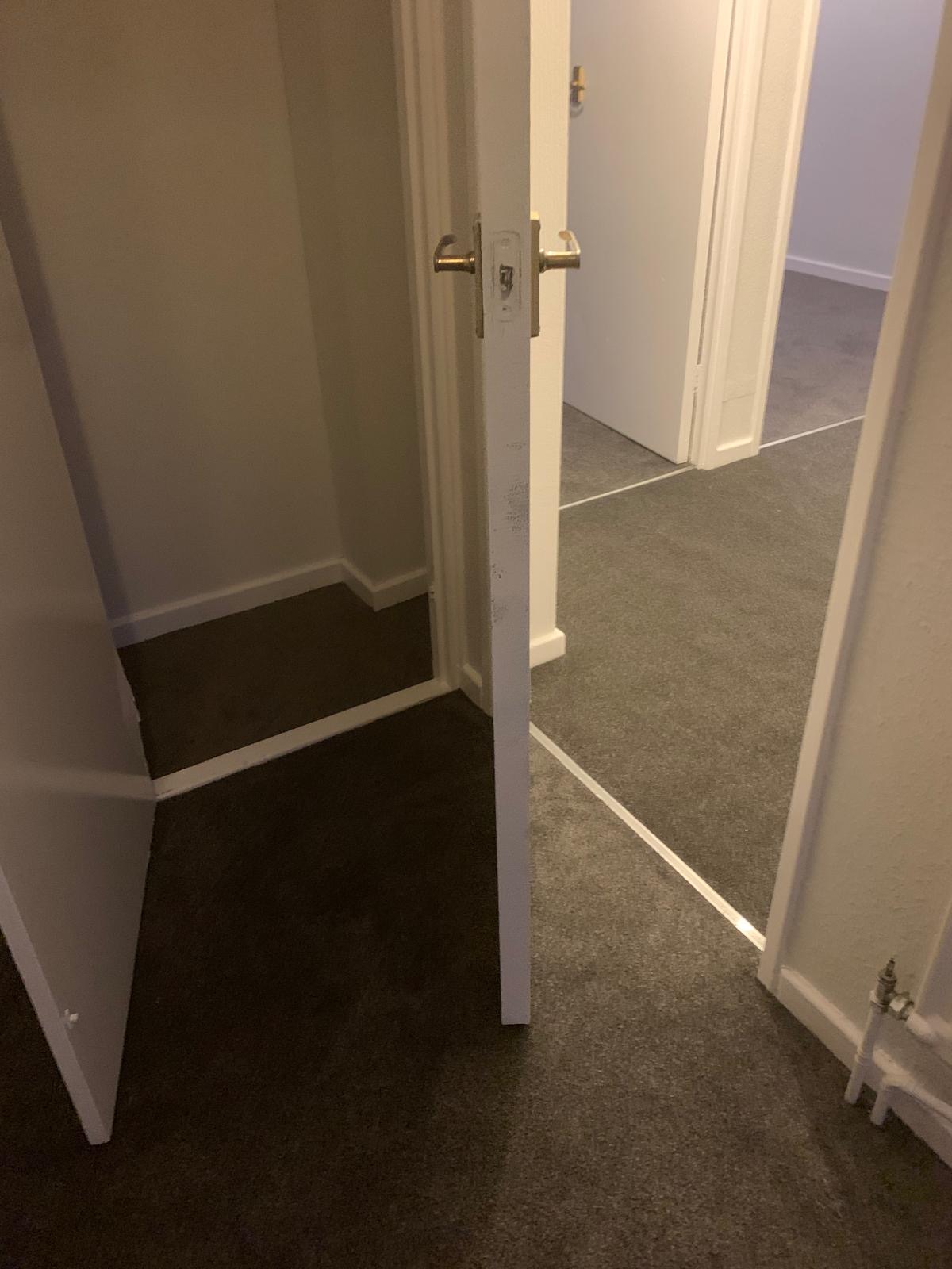 Dark carpet fitted on a landing