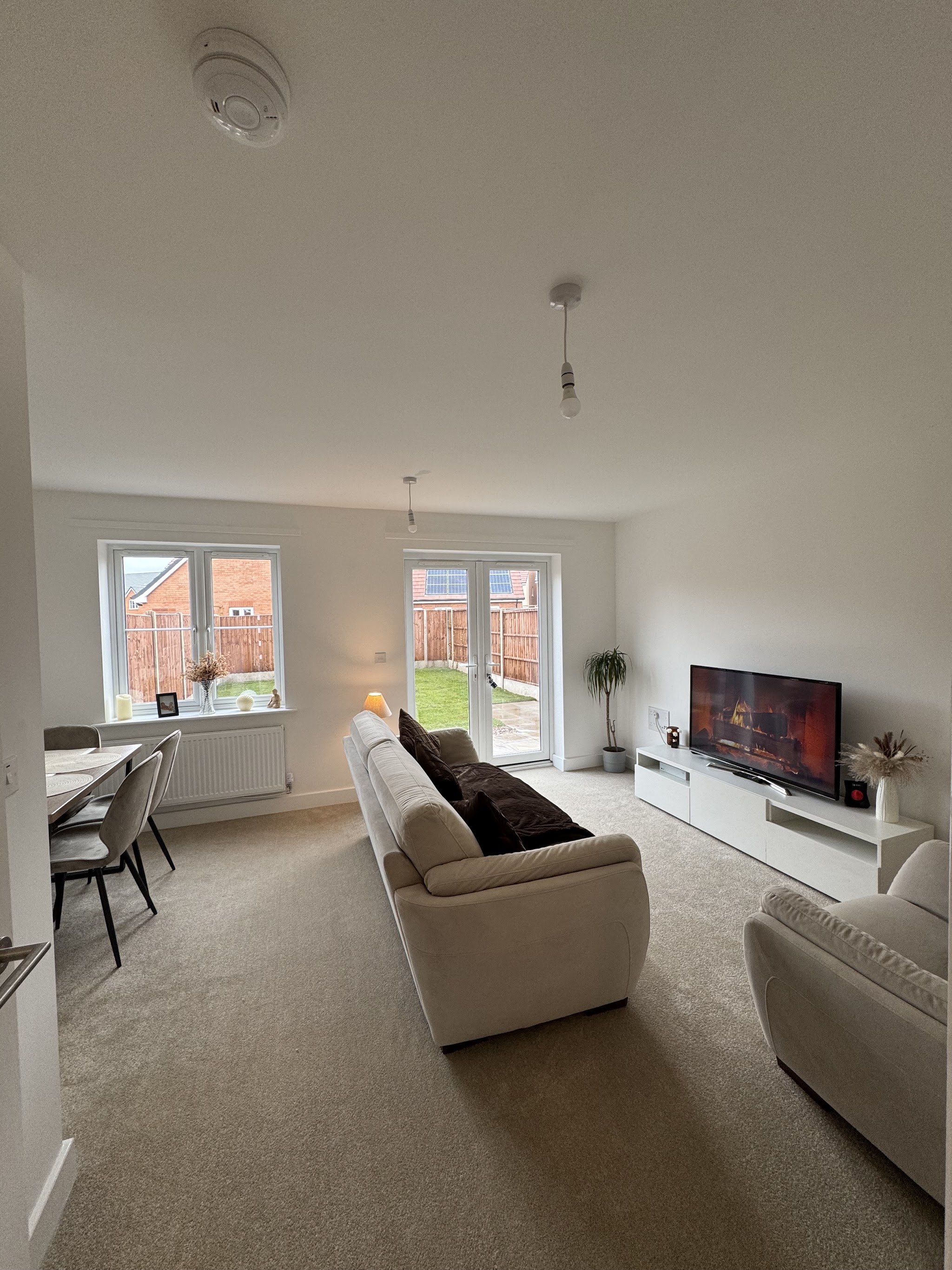 Beige carpet fitted through a new-build living room