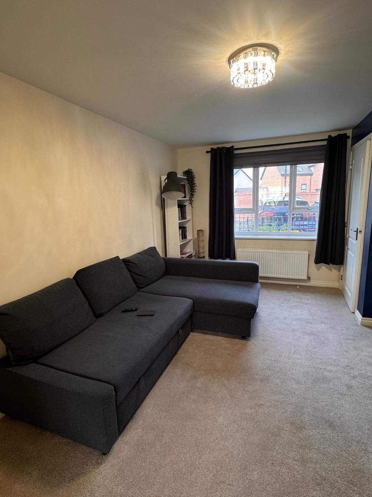 Lounge carpet fitted around a corner sofa